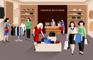 Shopify Boutique Themes - People shopping in a fashion boutique with clothes and accessories on display.