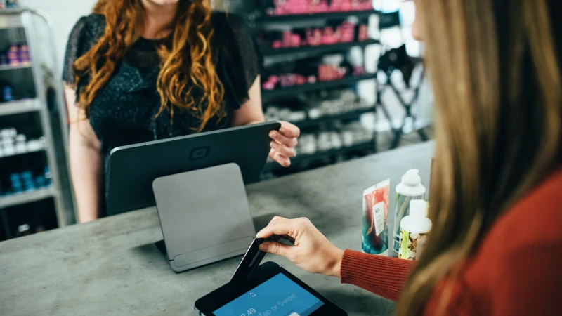 Maximizing Business Potential with Shopify POS-two women having in-store transaction