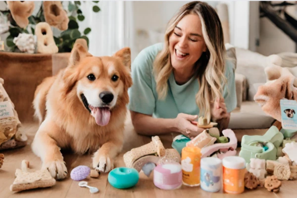 BARK's Dog-Centric Offerings - a dog parent and their happy pup, surrounded by BARK products like toys, treats, food, and dental care items,