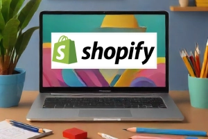 Shopify Targets Major Clients for Enhanced E-Commerce - a laptop on a desk with Shopify logo in the screen